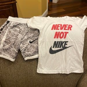 Good condition Nike shirt/shorts set. Shirt size 6, shorts size 5.